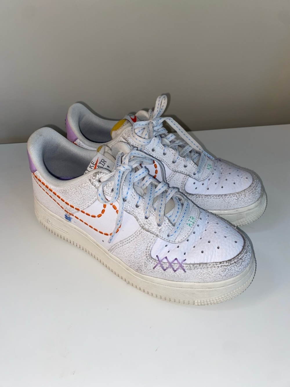 Nike Air Force 1 White Leather Sneakers with Multicolor Embroidered Stitching